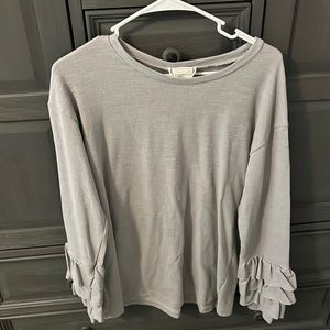 Woman’s gray sweater